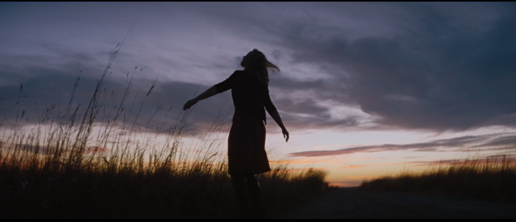 Jane (Rachel McAdams) enjoys a Malick-eqsue sunset in Oklahoma