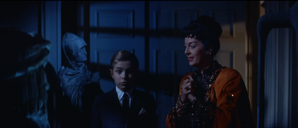 Auntie Mame explains what the sculptor did to her 'bust'
