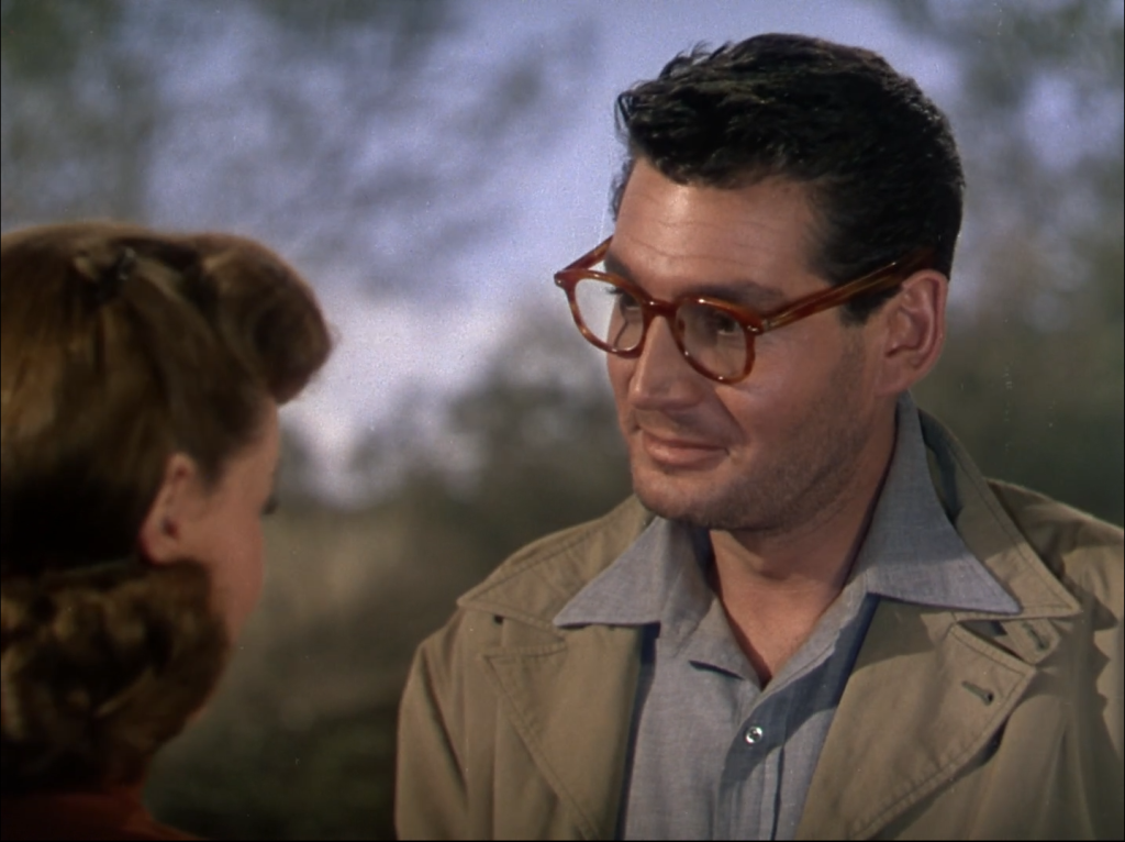 1950s gender politics: Sylvia Van Buren (Ann Robinson) and Clayton Forrester (Gene Barry) meet. Note the minor damage to the upper right of the frame. A screenshot from the iTunes HD version of War of the Worlds.