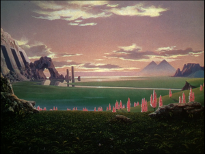 From When Worlds Collide on iTunes in HD. Zyra, the new world. Note the pyramids in the distance, and the caves ? To the left.