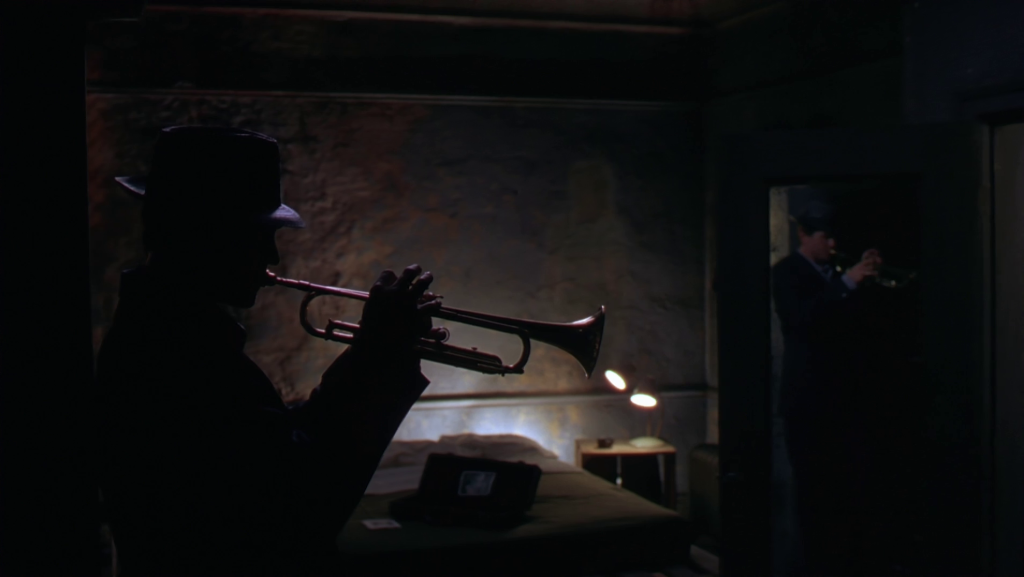 Yes. That's really Val Kilmer playing the trumpet in 'The Salton Sea'.