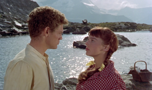 Disneys Third Man on the Mountain: Rudi (James MacArthur) and Lizbeth (Janet Munro) share a moment by an alpine lake.